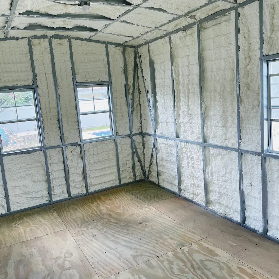 Closed-cell spray foam insulation applied to wall cavities in a residential project in Jackson